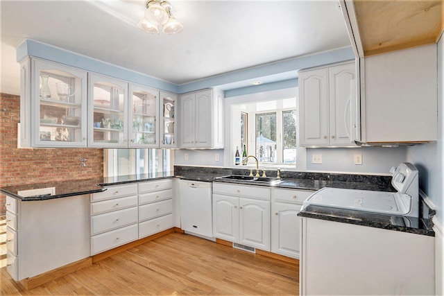 kitchen featuring light wood-type flooring, white appliances, sink, and white cabinets