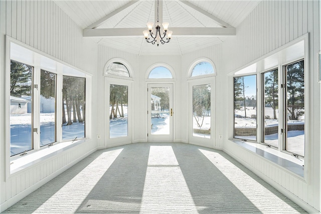 unfurnished sunroom featuring a chandelier and lofted ceiling with beams