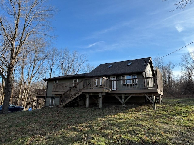 back of property featuring a lawn and a deck