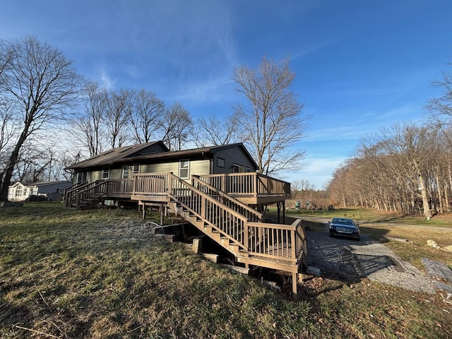 rear view of house featuring a deck