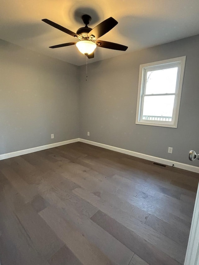 unfurnished room with ceiling fan and hardwood / wood-style flooring