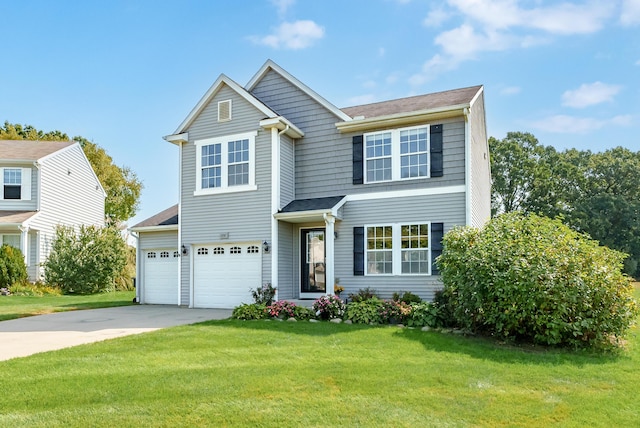 view of front facade with a front yard and a garage