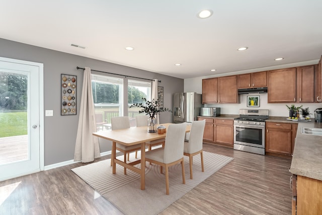 kitchen with dark wood-type flooring and appliances with stainless steel finishes