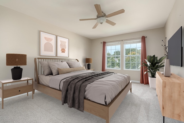 bedroom with ceiling fan and light colored carpet