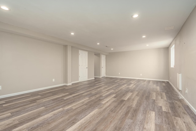 spare room with hardwood / wood-style floors