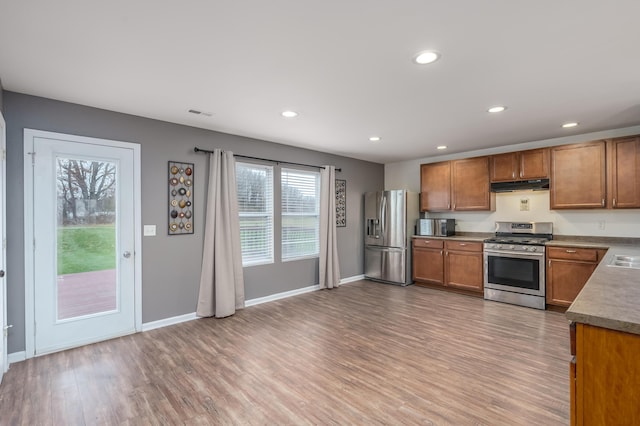 kitchen featuring wood-type flooring and appliances with stainless steel finishes