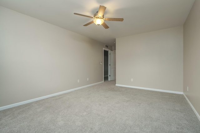 carpeted empty room with ceiling fan