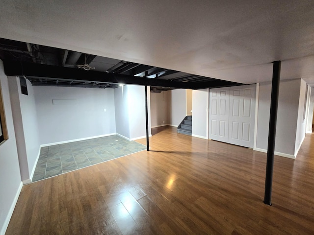 basement with wood-type flooring