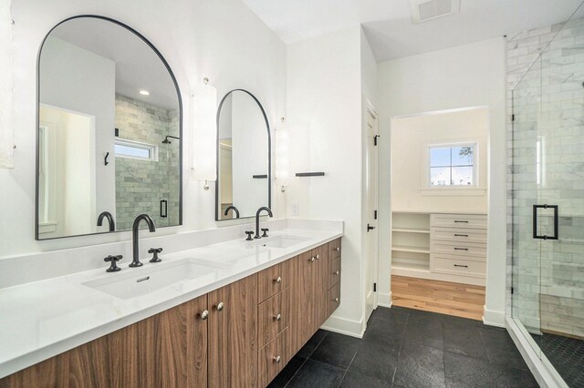 bathroom with vanity and walk in shower