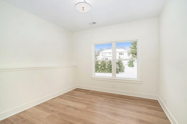 unfurnished room with light hardwood / wood-style floors