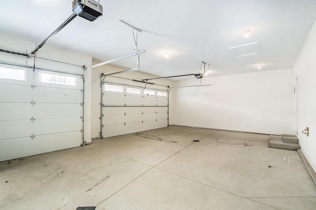 garage featuring a garage door opener