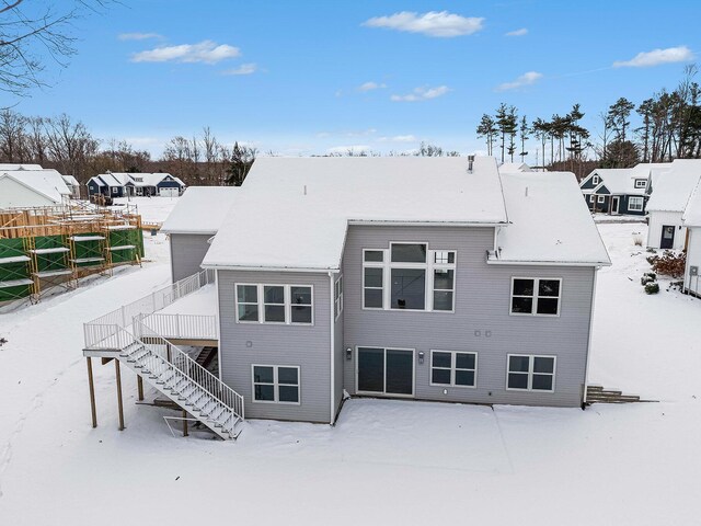 view of snow covered house