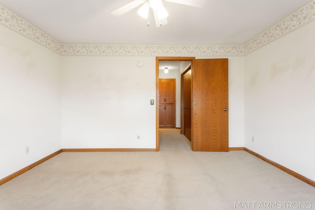 empty room with carpet flooring and ceiling fan