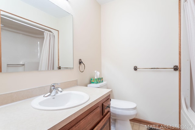 bathroom with a shower with shower curtain, vanity, toilet, and tile patterned flooring