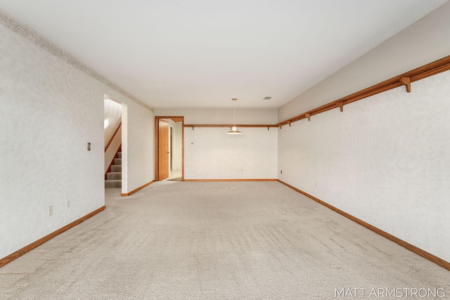 unfurnished room with carpet flooring