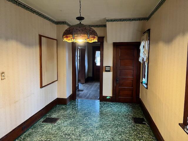 hallway with ornamental molding