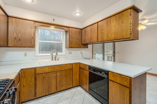 kitchen with dishwasher, sink, gas range, ceiling fan, and kitchen peninsula