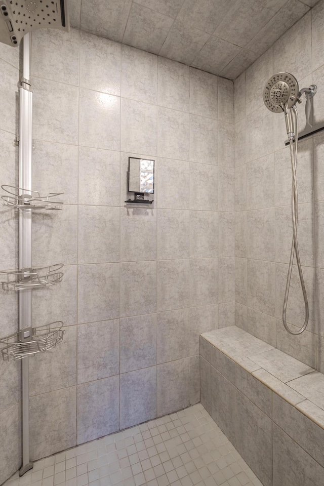 bathroom with tiled shower