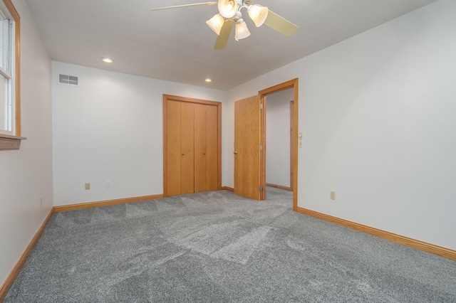 unfurnished room featuring carpet flooring and ceiling fan