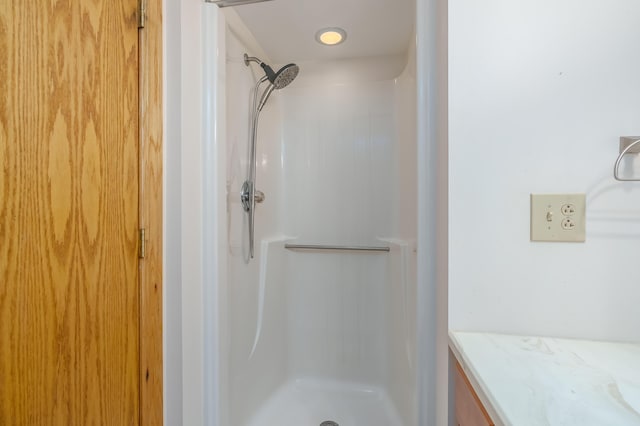 bathroom with vanity and walk in shower