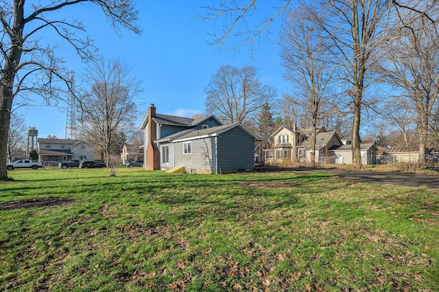 view of side of property featuring a yard