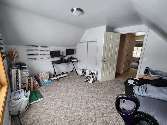 carpeted office featuring vaulted ceiling