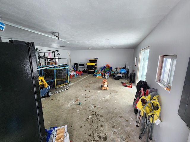 interior space with black refrigerator