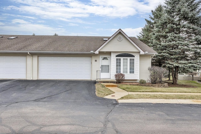 single story home with a garage