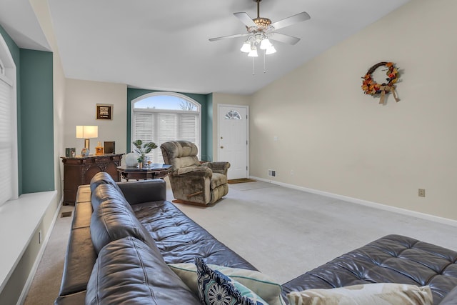 living room featuring light colored carpet, ceiling fan, and lofted ceiling