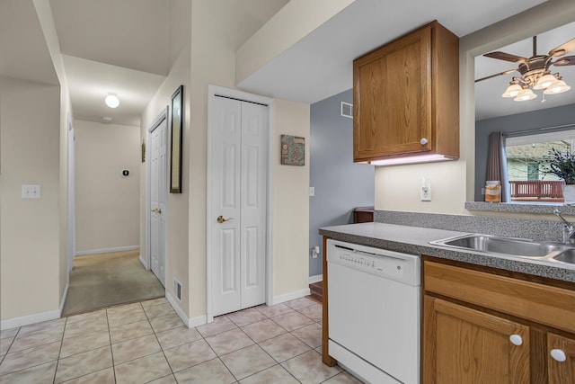 kitchen featuring light tile patterned floors, white dishwasher, ceiling fan, and sink