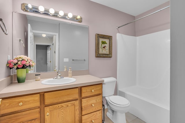 full bathroom with tile patterned floors, vanity, toilet, and washtub / shower combination