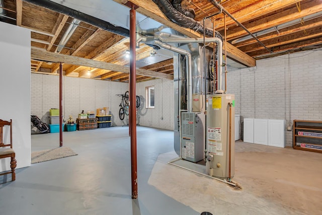 basement with gas water heater, heating unit, and brick wall