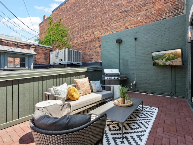 view of patio with an outdoor hangout area and a grill