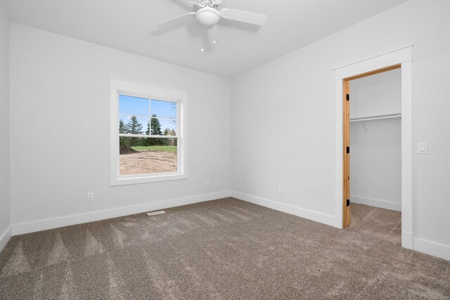 unfurnished bedroom featuring ceiling fan, carpet floors, and a closet