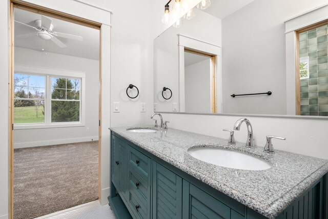 bathroom featuring ceiling fan and vanity