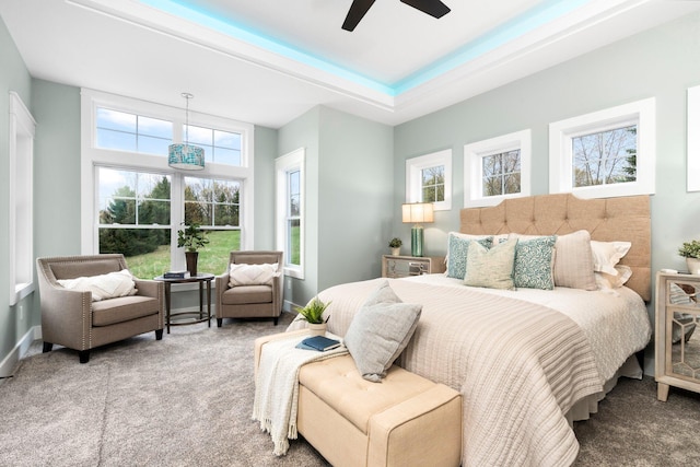 carpeted bedroom with ceiling fan and french doors