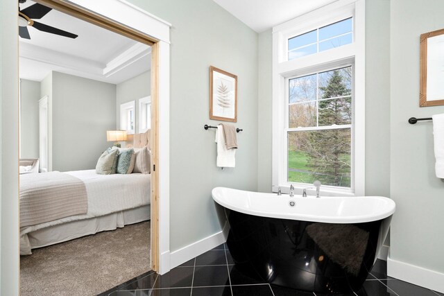 bathroom featuring tile patterned flooring, ceiling fan, and a bath