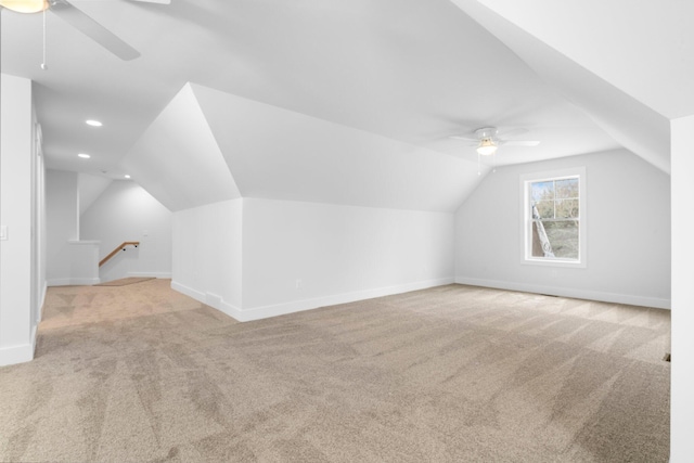 bonus room with ceiling fan, lofted ceiling, and light carpet