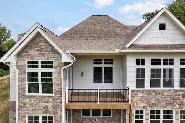 rear view of property with a balcony