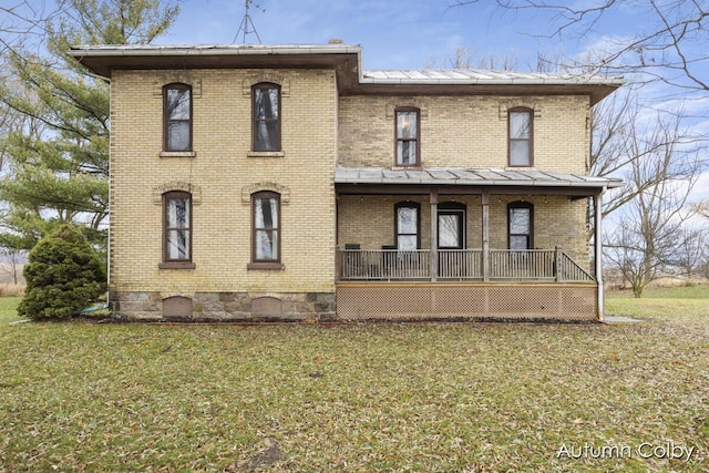 italianate house with a porch and a front lawn