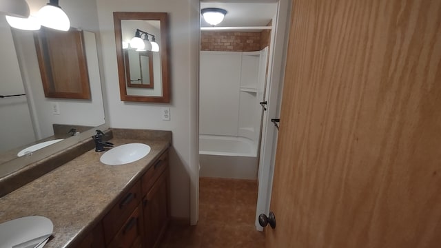 bathroom with tile patterned floors, vanity, and washtub / shower combination