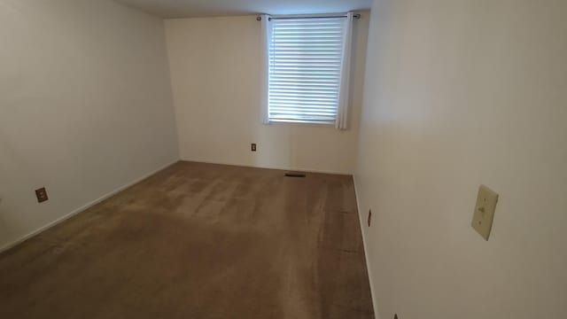 empty room with carpet flooring