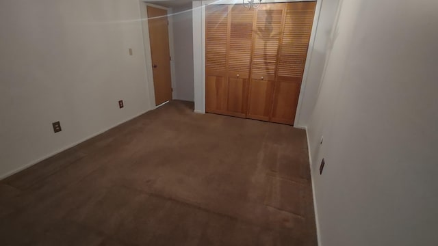 unfurnished bedroom with carpet flooring and a closet