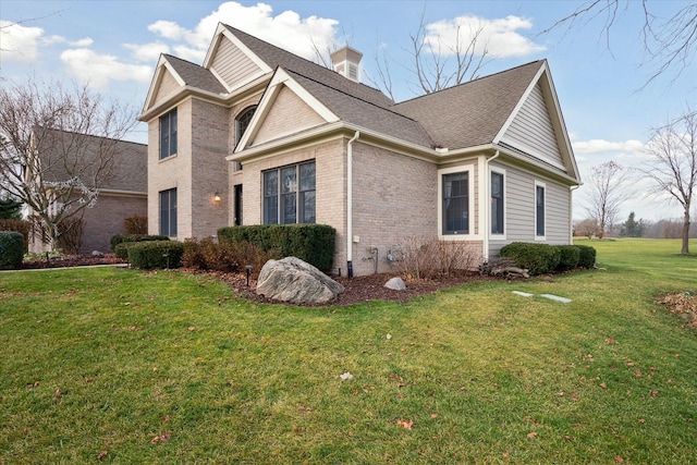 view of home's exterior with a lawn