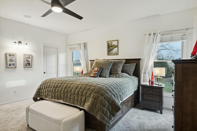 bedroom featuring light carpet and ceiling fan