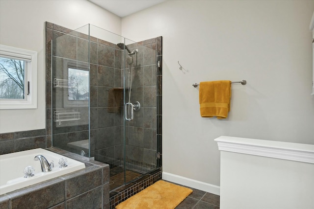 bathroom featuring tile patterned floors and independent shower and bath