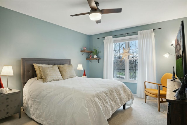 bedroom with light colored carpet and ceiling fan