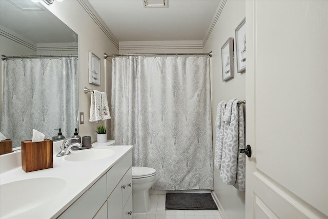 bathroom featuring tile patterned floors, toilet, vanity, and ornamental molding