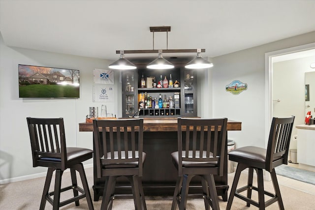 bar featuring pendant lighting and carpet floors