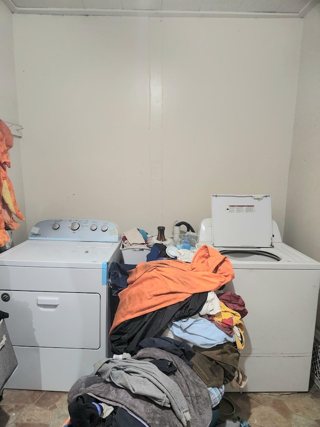 washroom featuring washer and clothes dryer